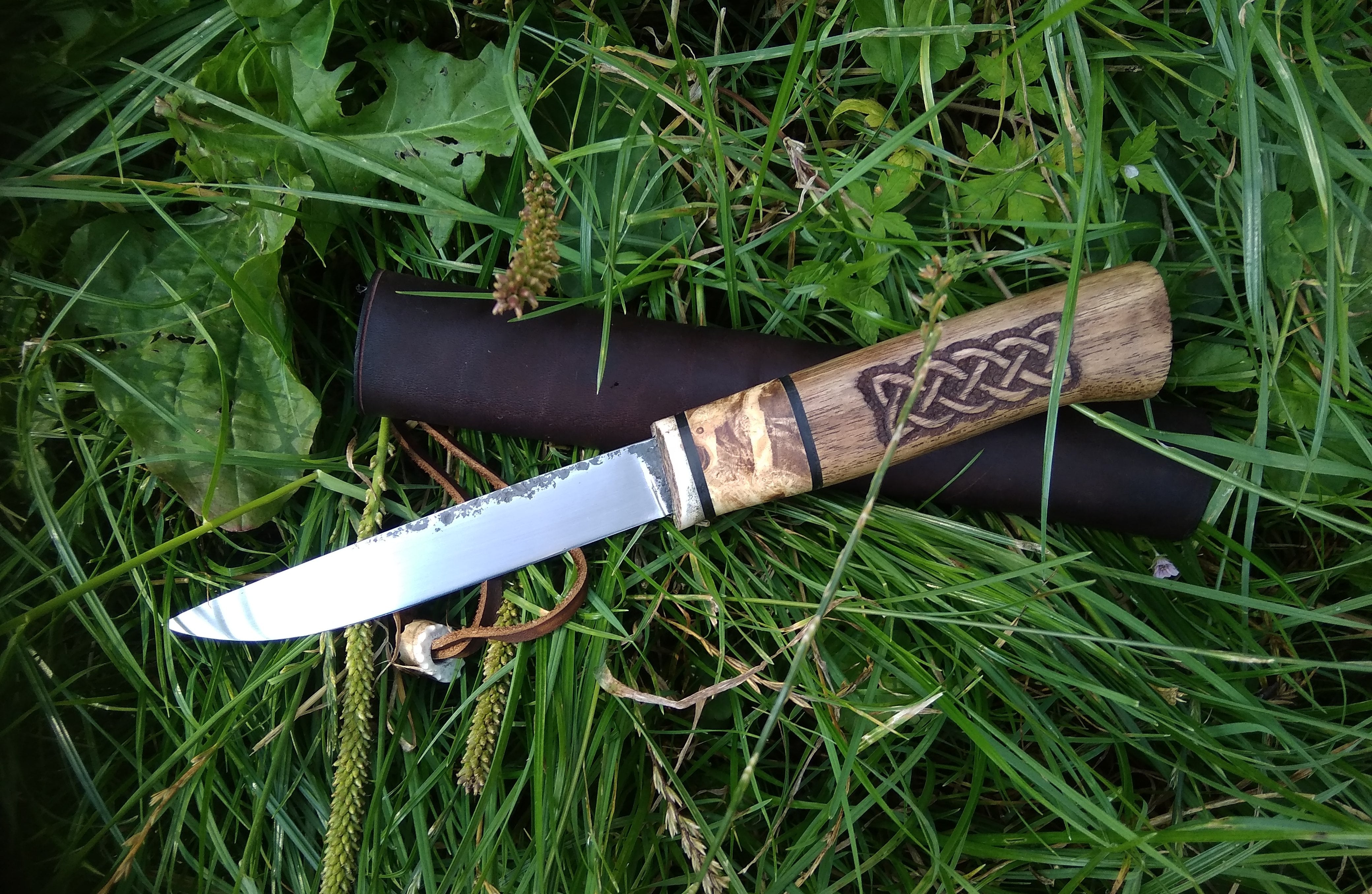 Small knife with leather sheath