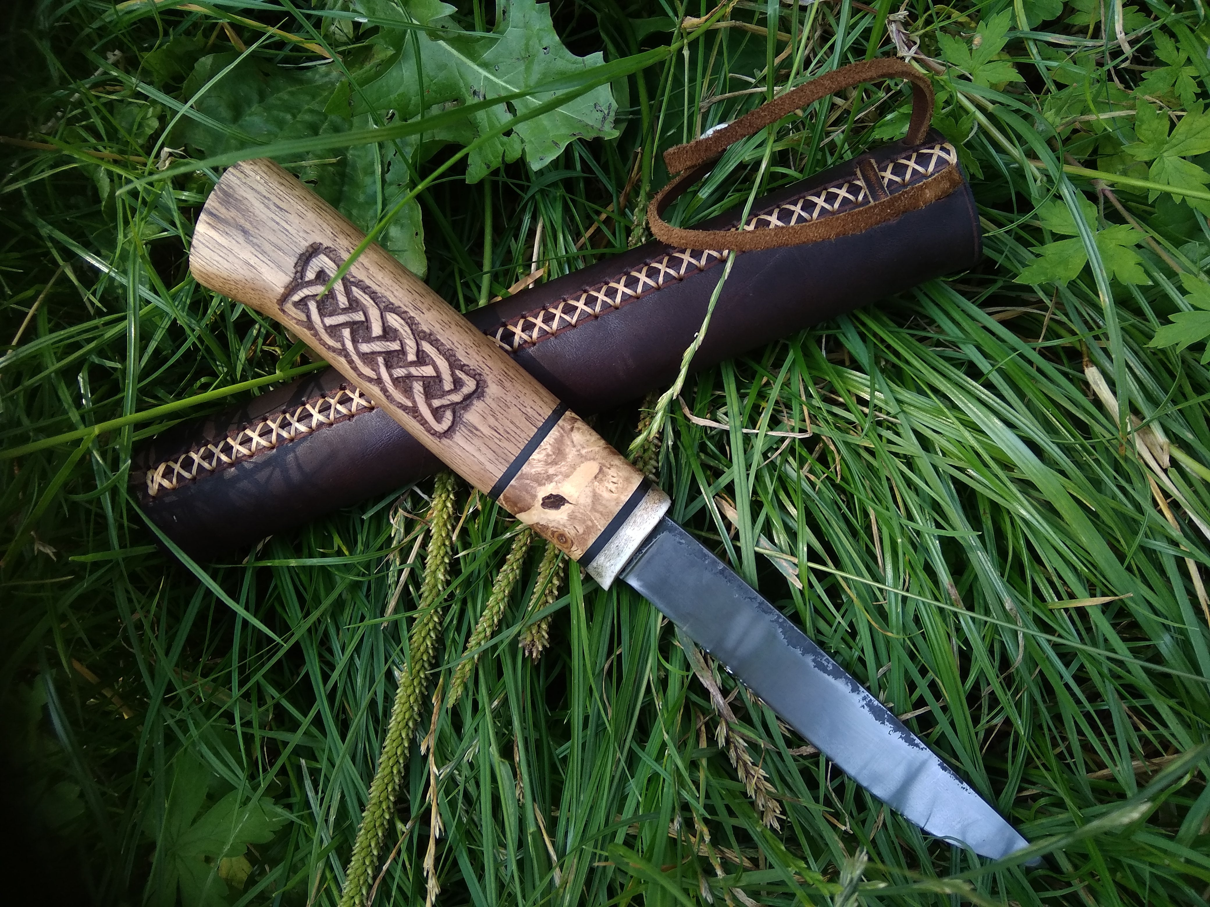 Small knife with leather sheath