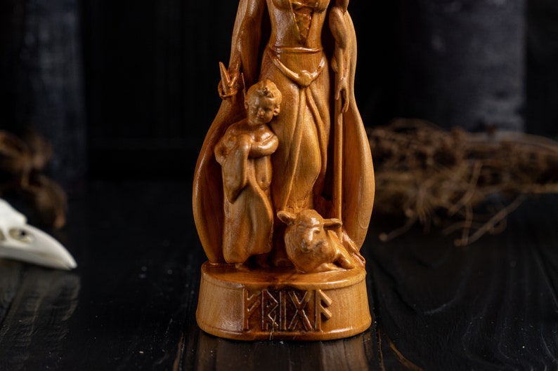 Wooden frigg figurine